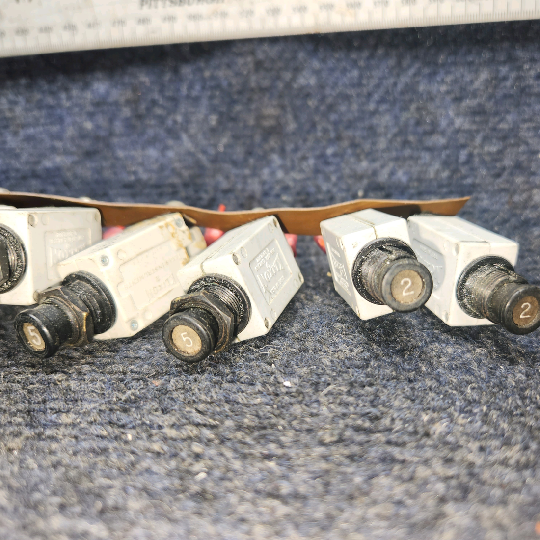 Used aircraft parts for sale, 7274-2-10 , 7277-2-5 , 7277-2-2 klixon Beechcraft A24R Circuit Breaker 2-10AMP/ 5-5AMP / 2-2AMP. Total Nine