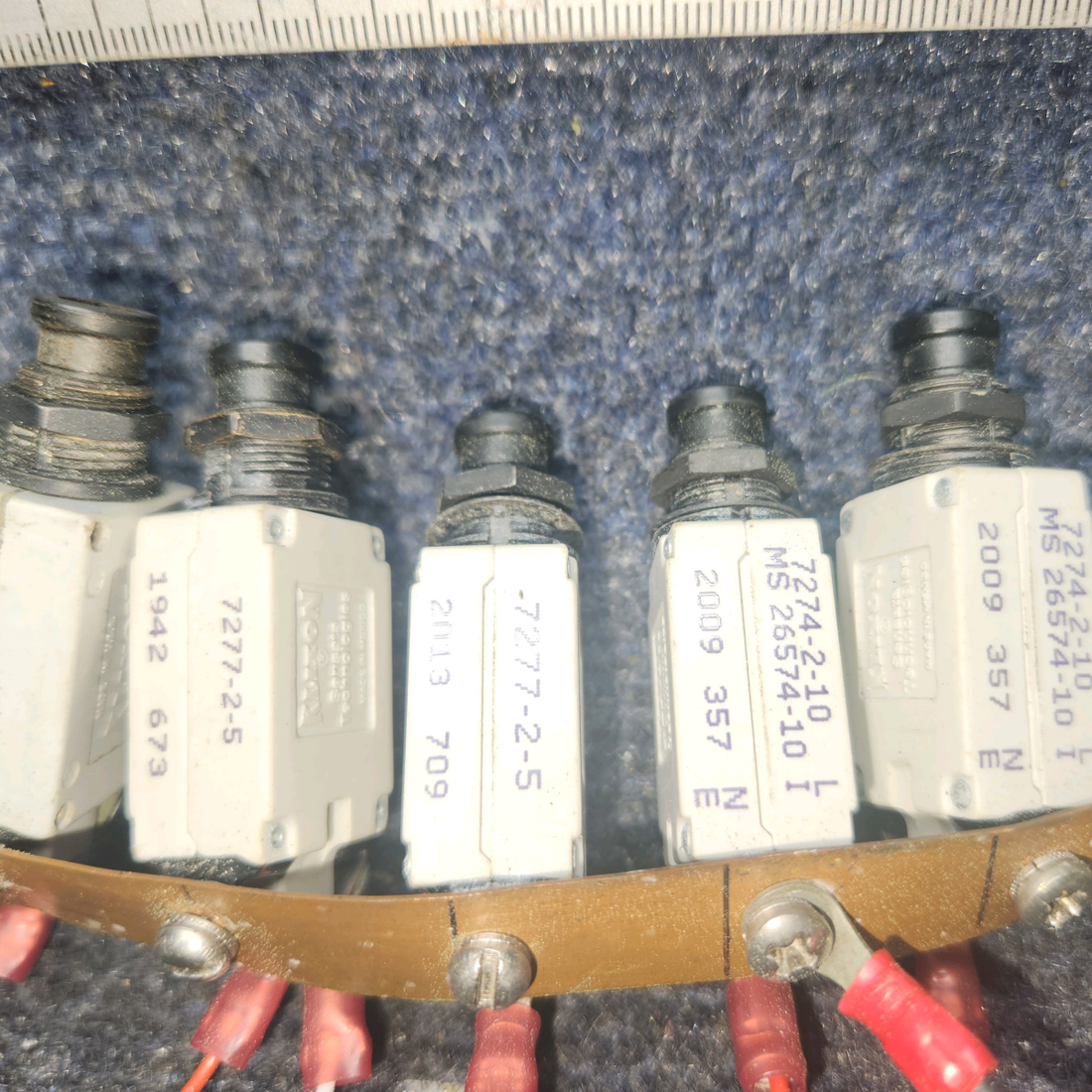Used aircraft parts for sale, 7274-2-10 , 7277-2-5 , 7277-2-2 klixon Beechcraft A24R Circuit Breaker 2-10AMP/ 5-5AMP / 2-2AMP. Total Nine